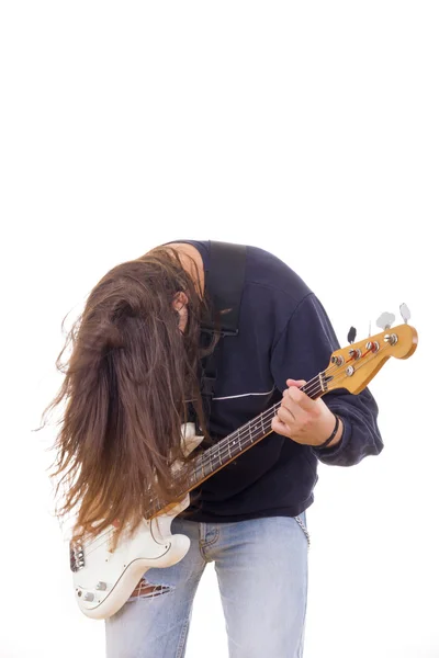 Male musician playing bass guitar with hair down — Stock Photo, Image