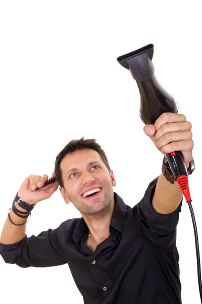 Attractive hairdresser using blow dryer and comb — Stock Photo, Image