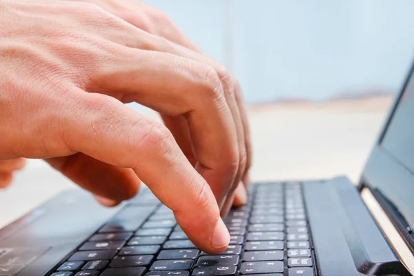 Closeup hands on laptop keyboard typing — Stock Photo, Image