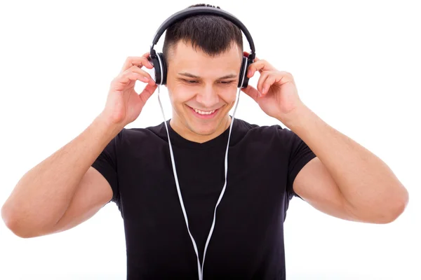 Menino bonito ouvir música com fones de ouvido — Fotografia de Stock