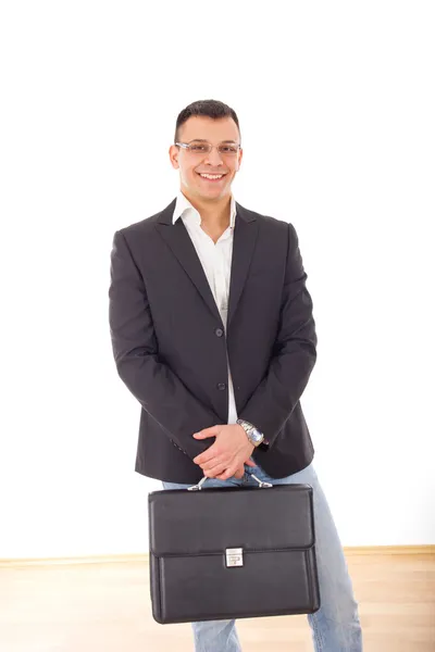 Hombre de negocios positivo en traje con maletín —  Fotos de Stock