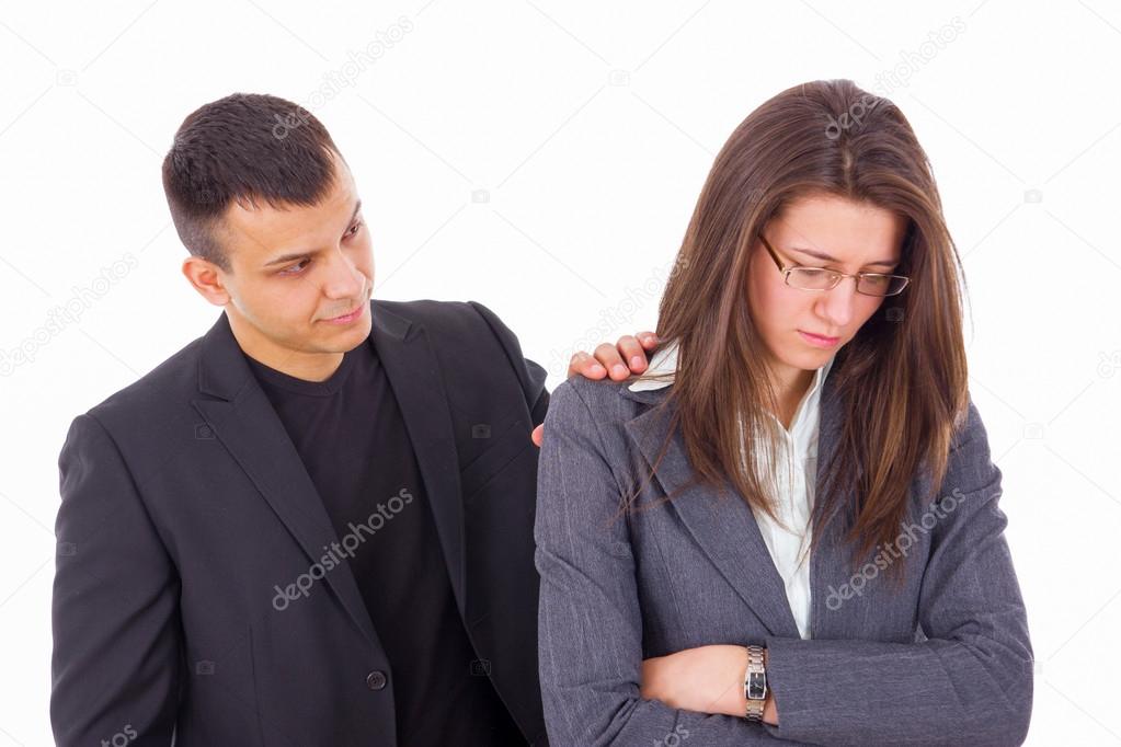 man comforting woman