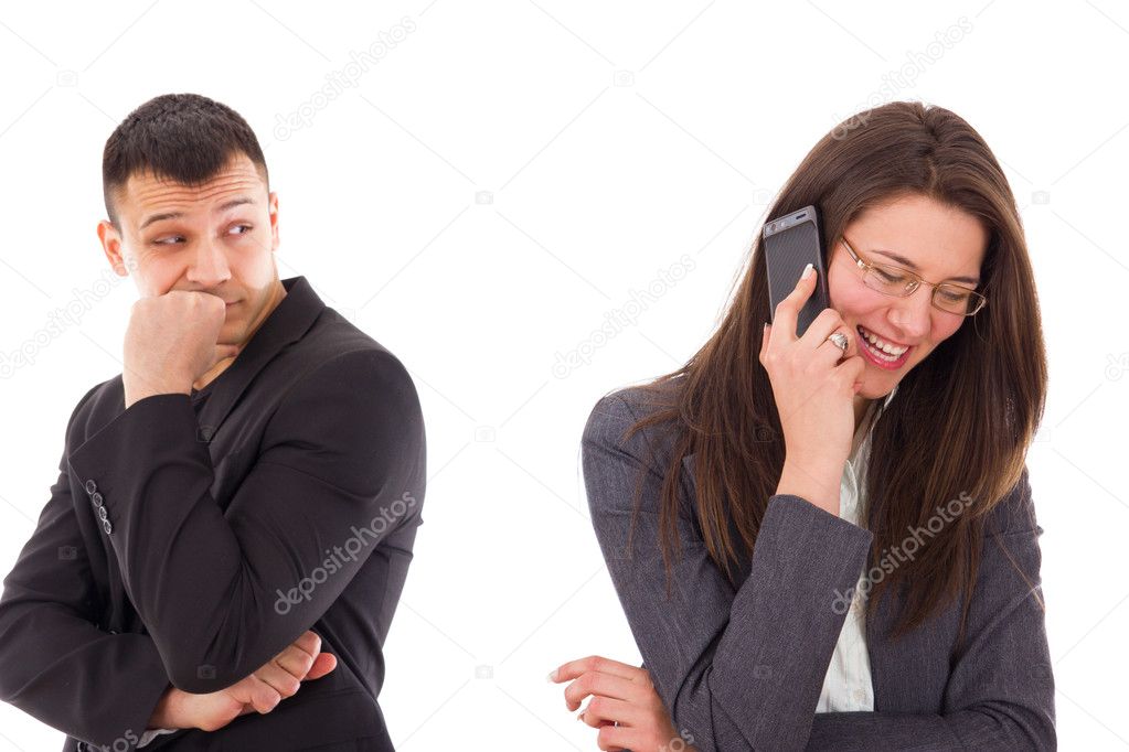 suspicious man looking at his woman talking on the phone