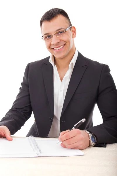 Bonito homem de negócios escrevendo em notebook — Fotografia de Stock