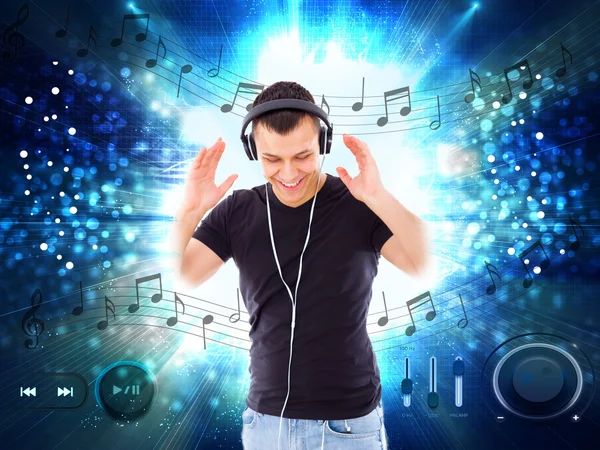 Handsome man with headphones and player buttons all around him — Stock Photo, Image