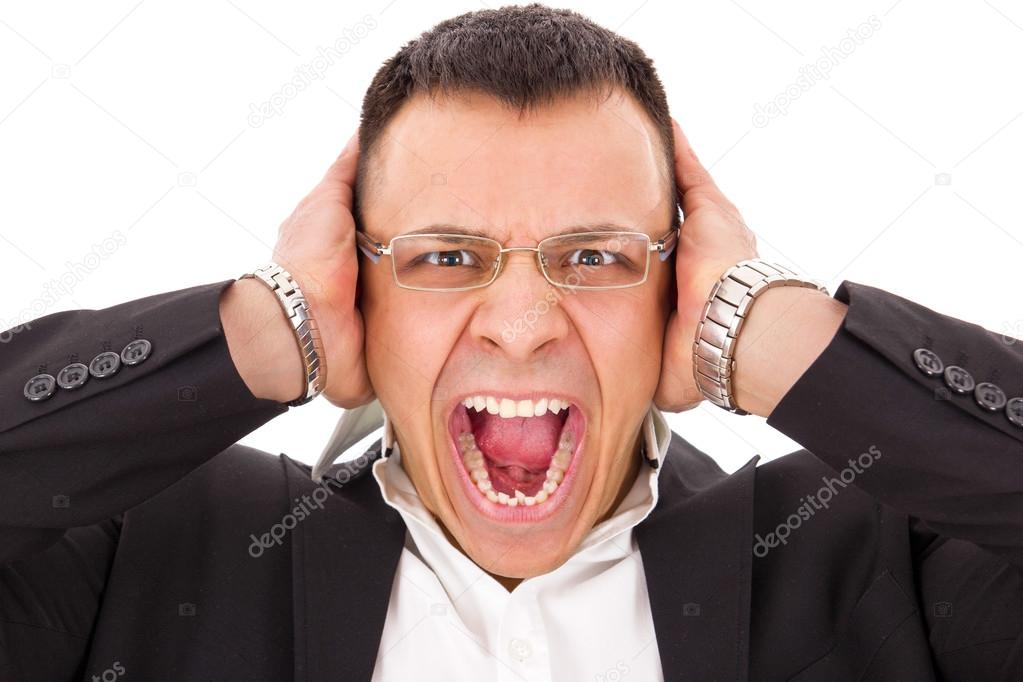 stressed man screaming holding his head