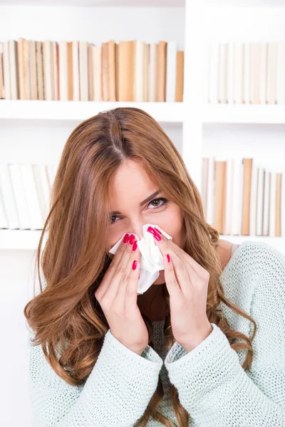 Beautiful girl feeling ill caught cold sniffles blowing her nose — Stock Photo, Image