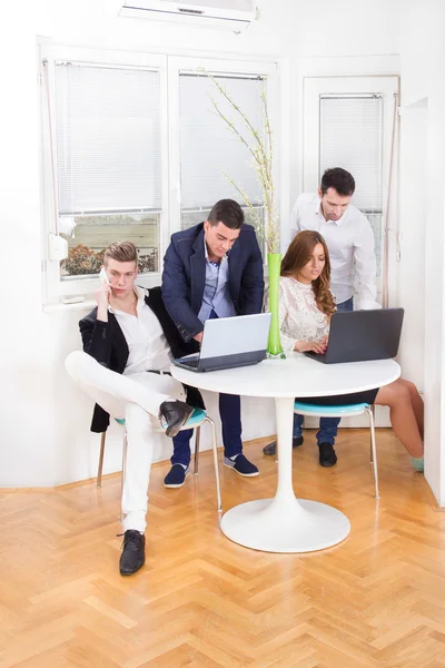 Team of business colleagues working together as partners — Stock Photo, Image