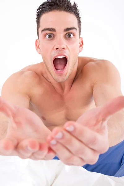 Half naked man in bed with hands out towards camera — Stock Photo, Image