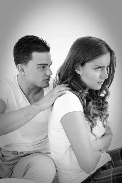 Young woman ignoring her man partner in her bed during a conflic — Stock Photo, Image