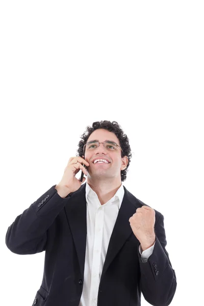 Мужчина в костюме говорит по мобильному и показывает признак успеха — стоковое фото