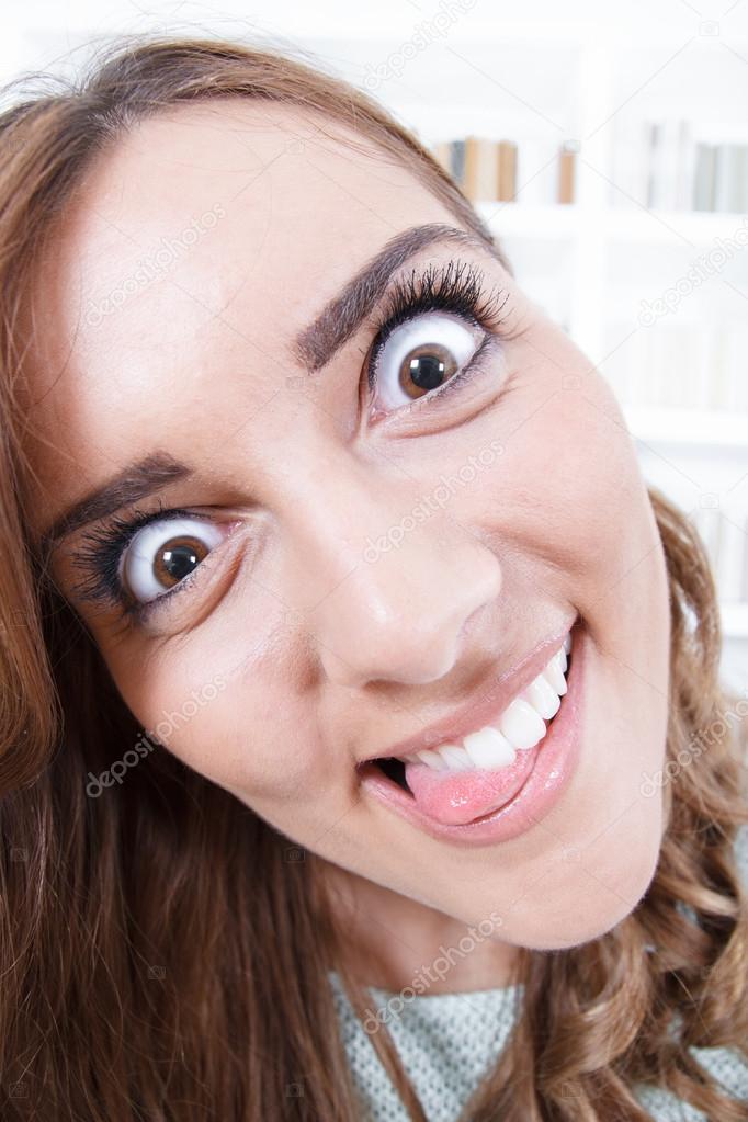 close up of young woman with crazy and mad face expression