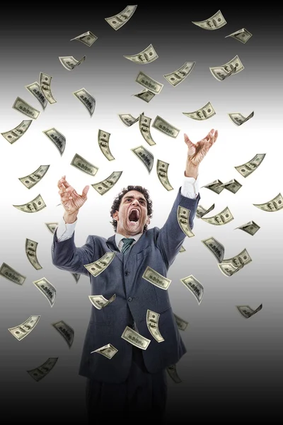 Business man under falling money banknotes screaming reaching fo — Stock Photo, Image