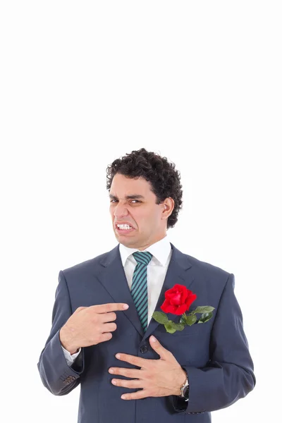 Man in suit with disgust shows with his hand flower which is in — Stock Photo, Image