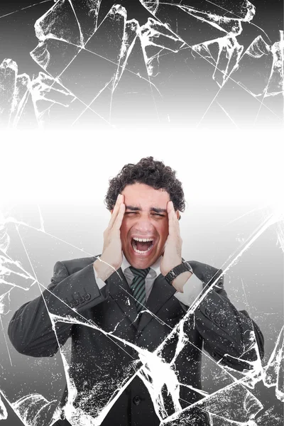 Troubled businessman with headache screaming in pain behind brok — Stock Photo, Image