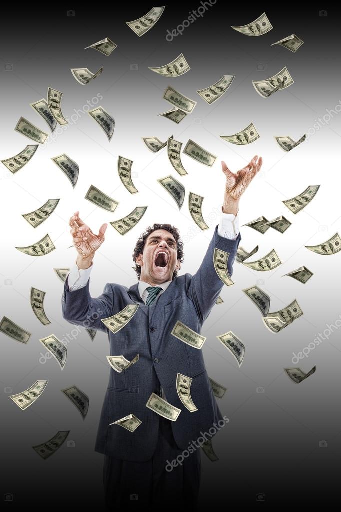 business man under falling money banknotes screaming reaching fo