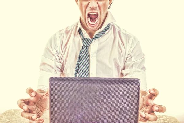 Half face business man  with laptop in front him on office desk — Stock Photo, Image