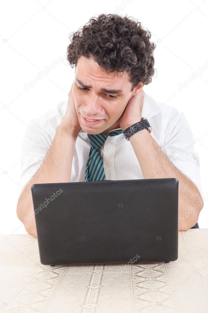 caucasian business man frustrated with work sitting in front of 