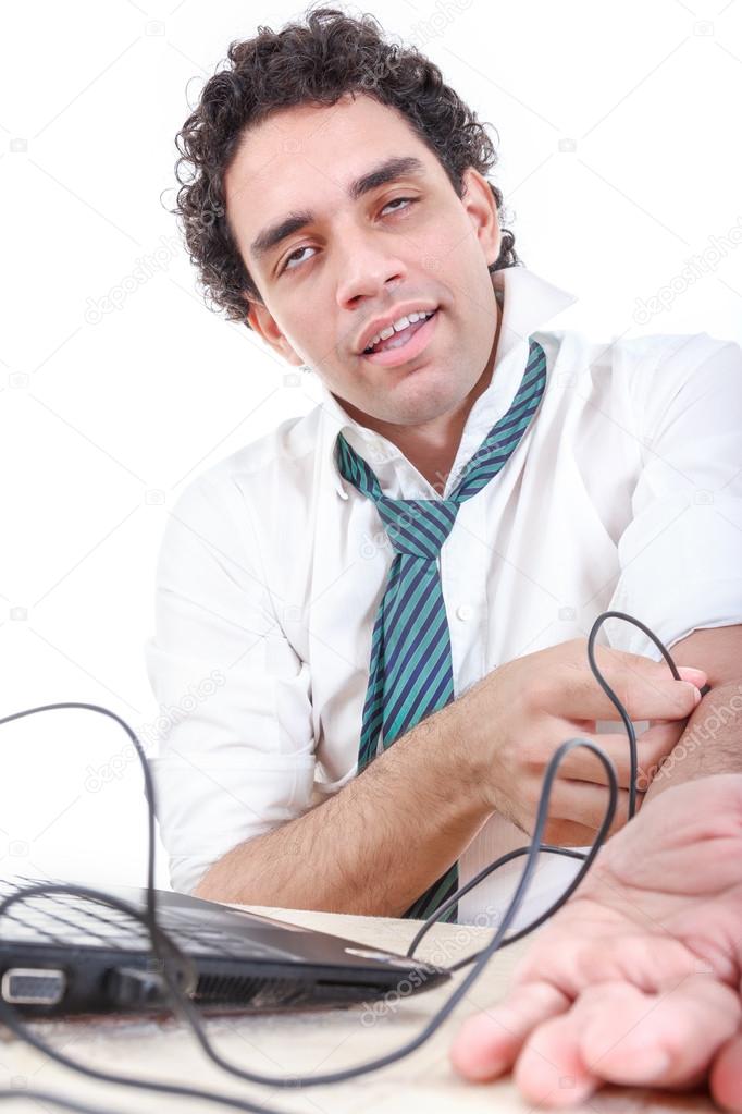 Man in suit addicted to internet put USB cable from laptop compu