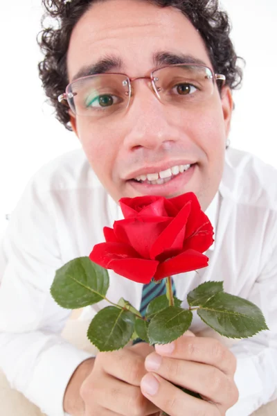 Romantischer Dummkopf mit roter Rose in der Hand — Stockfoto