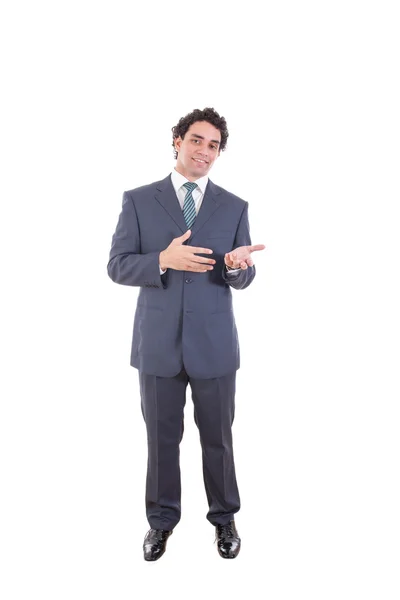 Sonriente hombre de negocios en traje negro poses casuales en el estudio mostrando —  Fotos de Stock