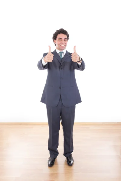 Young businessman showing thumbs up with both hands — Stock Photo, Image