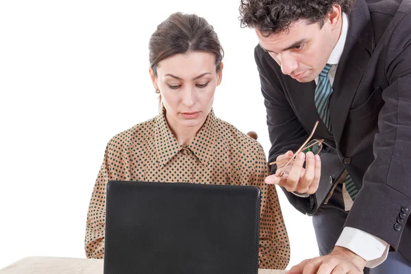 Boss and worried secretary working together on laptop — Stock Photo, Image