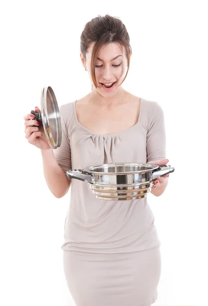 Pretty surprised woman opening a pot — Stock Photo, Image