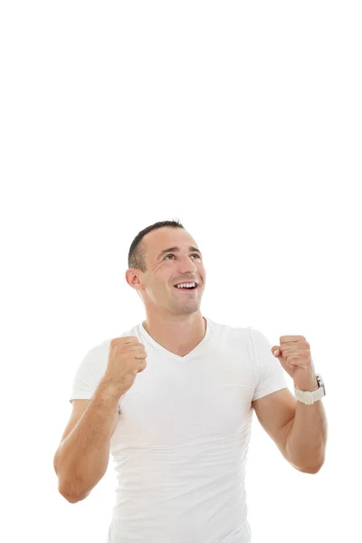 Man looking up with a slightly raised arms and clenched fists — Stock Photo, Image