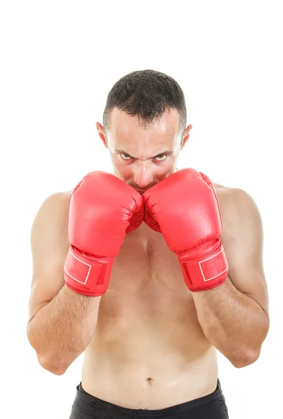 Homem musculoso com luvas de boxe vermelho conectado perto de seu rosto — Fotografia de Stock