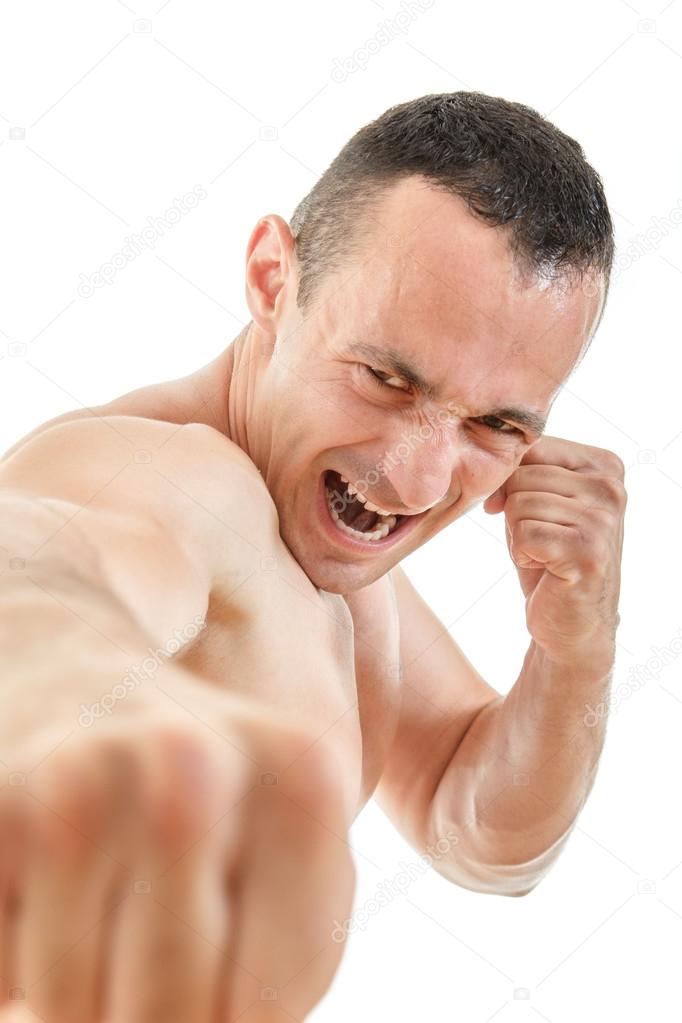 Close up portrait of kick boxer fighter punching with expression