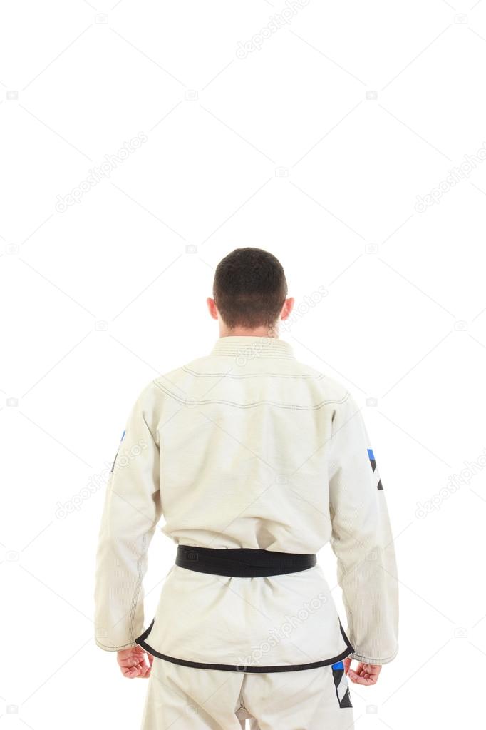 Kickbox fighter wearing kimono with black belt in back view