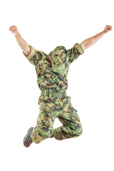 Soldie in camouflage uniform and hat jumping — Stock Photo, Image