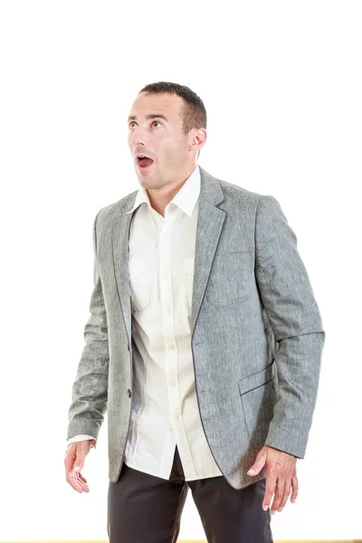 Surprised man in suit posing and looking up — Stock Photo, Image