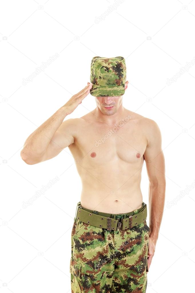 Soldier saluting standing proud and serious in military uniform