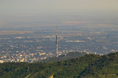 View of the TV tower of the city of Almaty from the mountains.