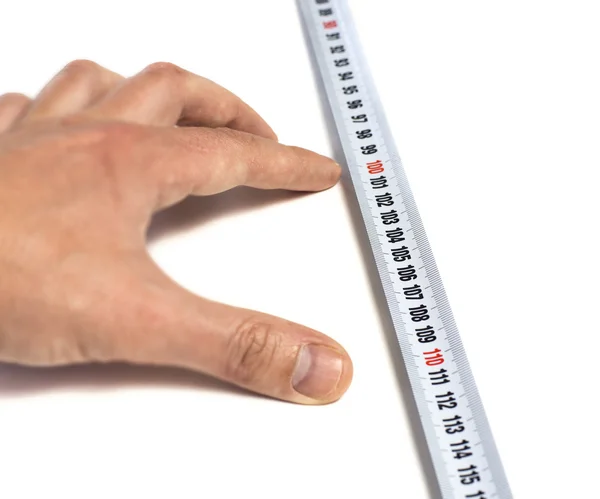 Hand specifying the distance on tape-measure — Stock Photo, Image