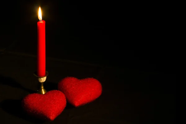 Burning candle with two hearts — Stock Photo, Image