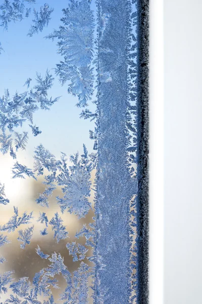 Winter patronen op vensterglas Stockafbeelding