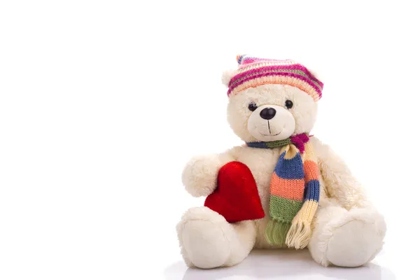 Speelgoed teddybeer zitten met Valentijn hart Rechtenvrije Stockfoto's
