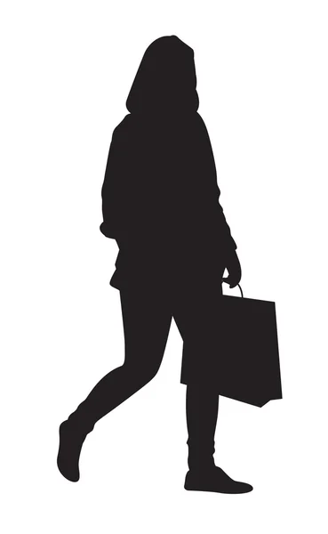 Meisje lopen met shopping bag - silhouet — Stockvector