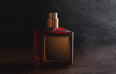 Red perfume and splashes on a dark background