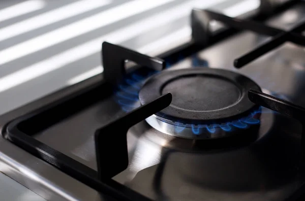 Burner with gas on the stove. The high price of gas in the world
