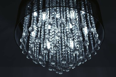 Stylish crystal chandelier in the room