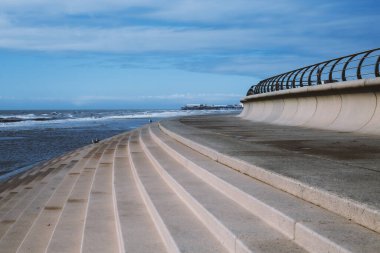 Steps on the promenade by the sea