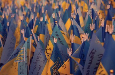 Many Ukrainian flags with the names of those who died in the war