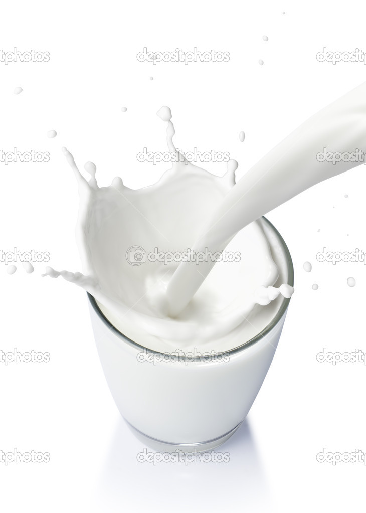 Pouring a glass of milk creating splash on a white background