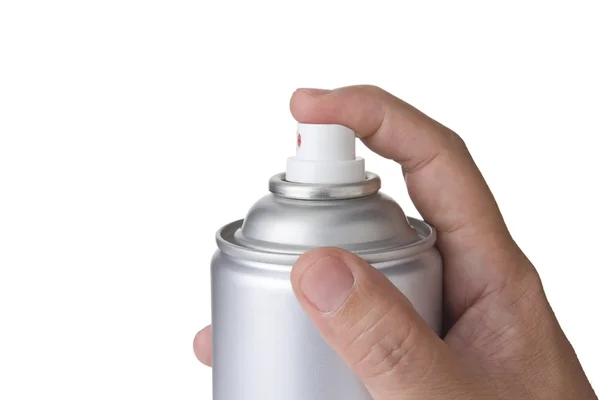 Uomo mano che tiene e spruzza una bomboletta spray in alluminio bianco, una bomboletta aerosol . — Foto Stock