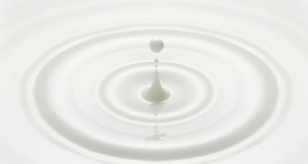 Milk drop created ripple wave — Stock Photo, Image