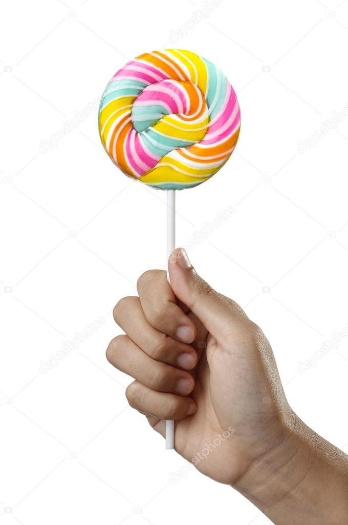 Hand holding Colorful Spiral lollipop candy on stick